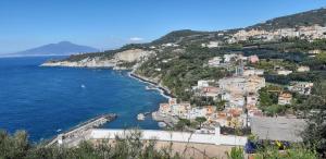 a view of a town on a hill next to the ocean at Il Profumo di Capri in Massa Lubrense