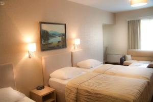 Katil atau katil-katil dalam bilik di Philia Hotel