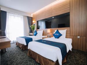 Voodi või voodid majutusasutuse Spring Hotel Hanoi toas +22 fotot