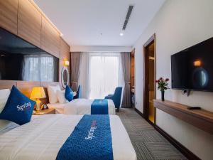En eller flere senger på et rom på Spring Hotel Hanoi