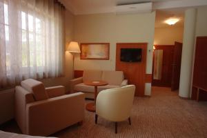 TV a/nebo společenská místnost v ubytování Hotel Sahara