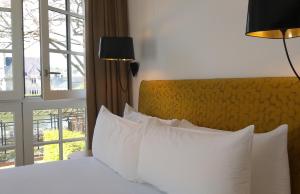 Postel nebo postele na pokoji v ubytování Hôtel Ginkgo - SPA Biloba