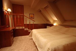 Postel nebo postele na pokoji v ubytování Hotel Sahara