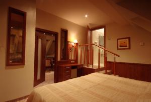 Postel nebo postele na pokoji v ubytování Hotel Sahara