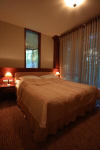 Postel nebo postele na pokoji v ubytování Hotel Sahara