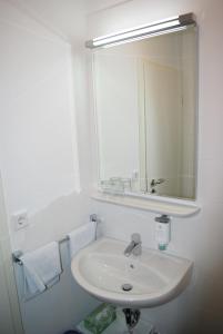 Koupelna v ubytování Hotel Garni am Hechenberg