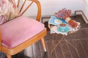 a table with a plate of food and a cup of coffee at Moshinos Hotel in Ayvalık