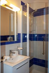 a bathroom with a sink and a shower at Il Borgo Antico Sorrento Sea View in Sorrento +22 photos