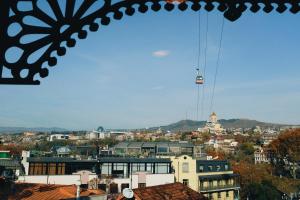 a view of a city with a cable car at Maison Boutique Hotel in Tbilisi City