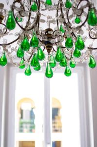a chandelier hanging over a door with a window at Il Genovino in Genoa