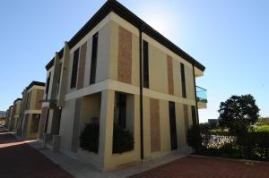 a building with black and white windows on a street at Gold City Premium Private Pool Villa with Free Aqua Park in Alanya