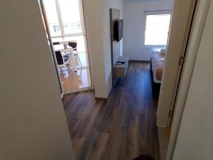 a living room with a wooden floor and a mirror at Apartments AS Dubrave in Dubrave Gornje +34 photos