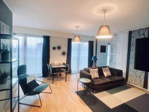 TV a/nebo společenská místnost v ubytování ART Garden Towers Prague