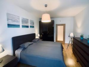 Postel nebo postele na pokoji v ubytování ART Garden Towers Prague