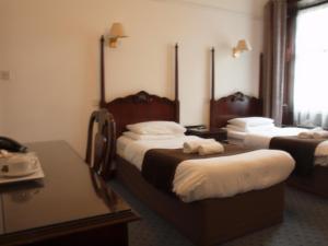 Krevet ili kreveti u jedinici u okviru objekta Argyll Arms Hotel