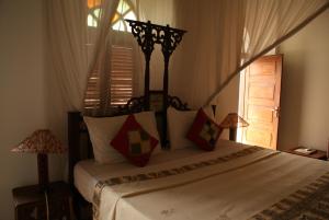 Letto o letti in una camera di The Swahili House