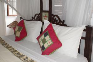 Letto o letti in una camera di The Swahili House