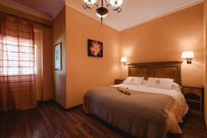 Postel nebo postele na pokoji v ubytování Hotel La Culla Del Lago