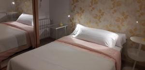Postel nebo postele na pokoji v ubytování La Casa de Begoña