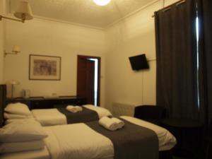 Krevet ili kreveti u jedinici u okviru objekta Argyll Arms Hotel