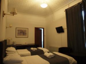 Krevet ili kreveti u jedinici u okviru objekta Argyll Arms Hotel
