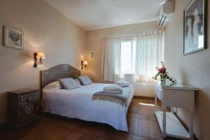 Postel nebo postele na pokoji v ubytování Hotel La Culla Del Lago