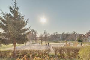a field with a lot of trees and a fence at Dream Loft Krosna in Gdańsk