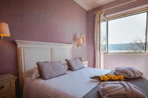 Postel nebo postele na pokoji v ubytování Hotel La Culla Del Lago