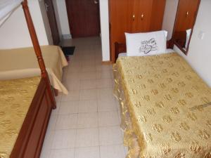 Een bed of bedden in een kamer bij Mirema Hotel