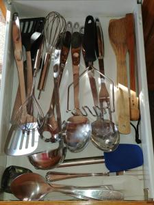 a drawer filled with lots of kitchen utensils at 3 Bedrooms 3 beds near metro -2 Parking Free in Montreal