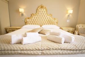 Lova arba lovos apgyvendinimo įstaigoje Hotel Villa Margherita