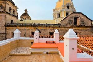 a bench on the roof of a building at Casa San Pedro - Exclusive 3BR Colonial Apt in Centro Historico by Huespedia in Cartagena de Indias