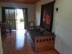 a living room with a couch and a table at Casas de Raco in Raco