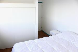 Postelja oz. postelje v sobi nastanitve Bahía Luz Hostal