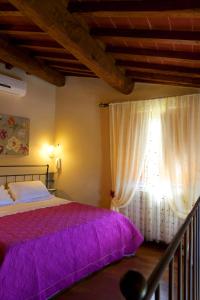 Postel nebo postele na pokoji v ubytování La Casa del Melograno + 24 fotografií