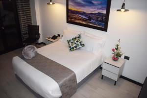 Ένα ή περισσότερα κρεβάτια σε δωμάτιο στο Hotel RDOS