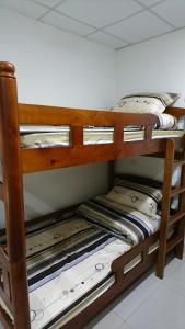 two bunk beds in a small room at Guotai Backpack in Kaohsiung