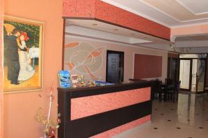 a bar in a room with a painting on the wall at Ryor Hotel - Restaurant & Free Parking in Sunny Beach +50 photos