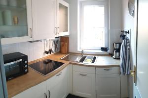 Kuchyň nebo kuchyňský kout v ubytování Ferienwohnung *Windstille*
