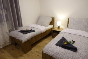 Postelja oz. postelje v sobi nastanitve Apartmány MAX