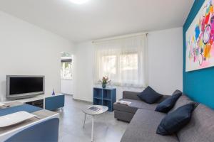 TV a/nebo společenská místnost v ubytování Apartment Dora
