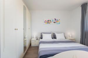 Postel nebo postele na pokoji v ubytování Apartment Dora