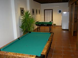 a pool table in the middle of a room at Hotel YOUHEY am Wolfgangsee in Strobl