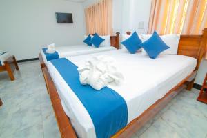 Postel nebo postele na pokoji v ubytování Hotel Sun Blue