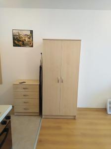 a cabinet and a dresser in a room at Aspen golf studio apartment D208 in Razlog +22 photos