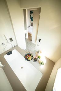 an overhead view of a room with a bowl of food at Hotel Miranda in Riva di Solto +37 photos