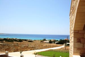 a view of the ocean from a house at Romantica Apartments in Falasarna