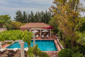 an aerial view of a house with a swimming pool at Metohi Georgila in Maleme