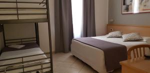 Posteľ alebo postele v izbe v ubytovaní Hotel Astor