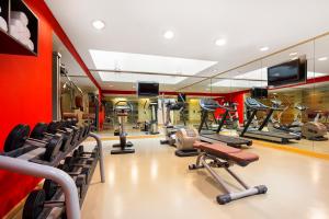 a gym with cardio equipment and a mirror at Ibis Al Rigga in Dubai